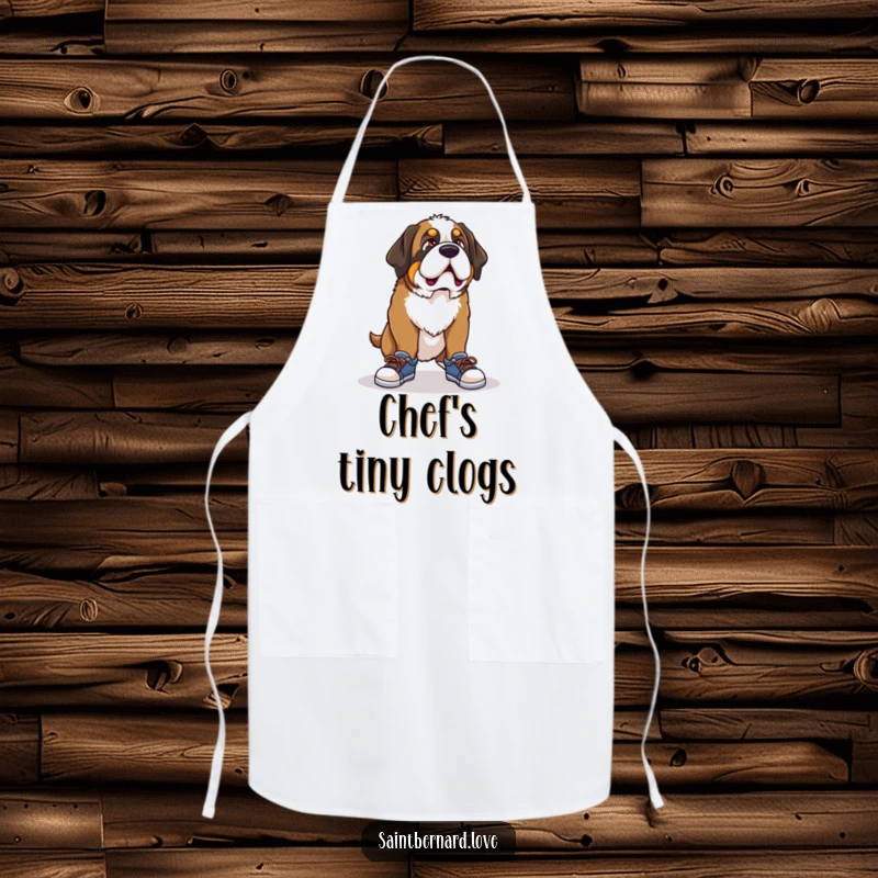 Funny Saint Bernard apron, a kitchen accessory showing a dog with a comical expression trying on tiny shoes, adding humor to cooking.