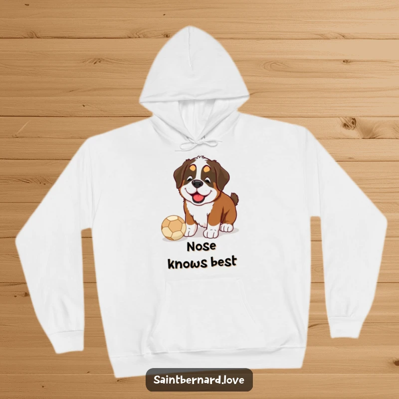 Funny Saint Bernard hoodie design, a happy dog enthusiastically nudging a ball with its nose, perfect for gifting.