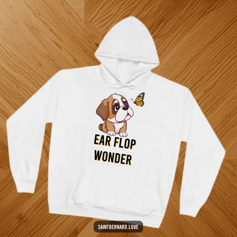 Funny Saint Bernard hoodie depicting a loyal dog with one ear flopped, gazing with utmost curiosity at a butterfly, blending comfort with a touch of whimsy.