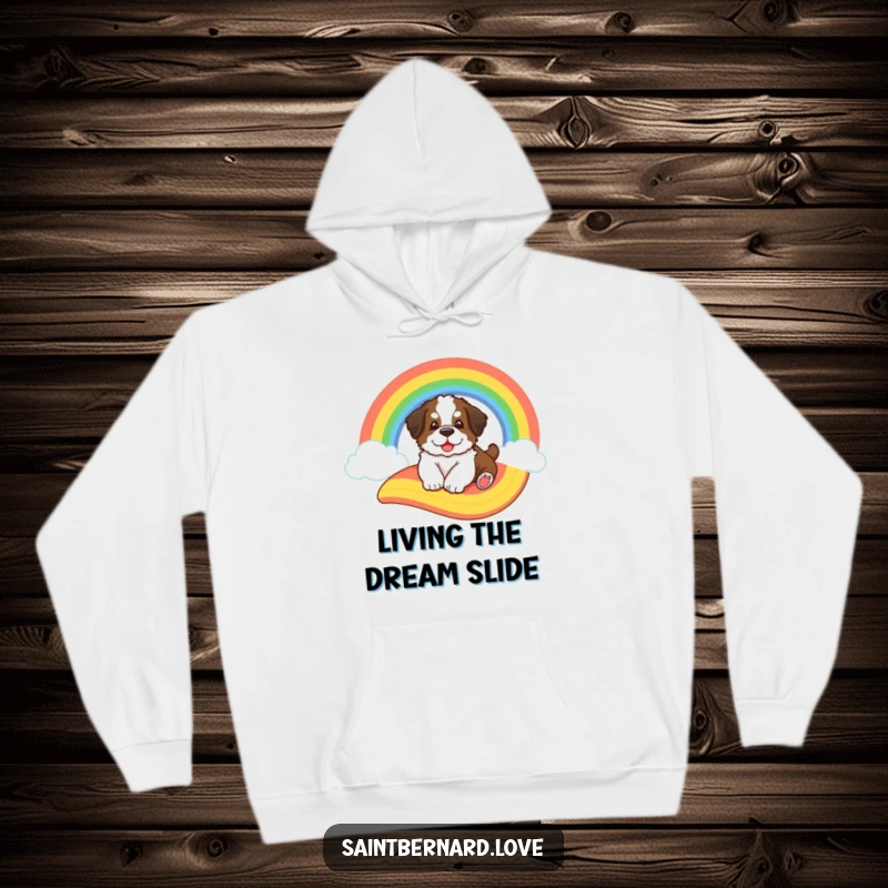 Funny Saint Bernard hoodie, showing a big fluffy puppy sliding down a cartoon rainbow, radiating happiness and warmth.