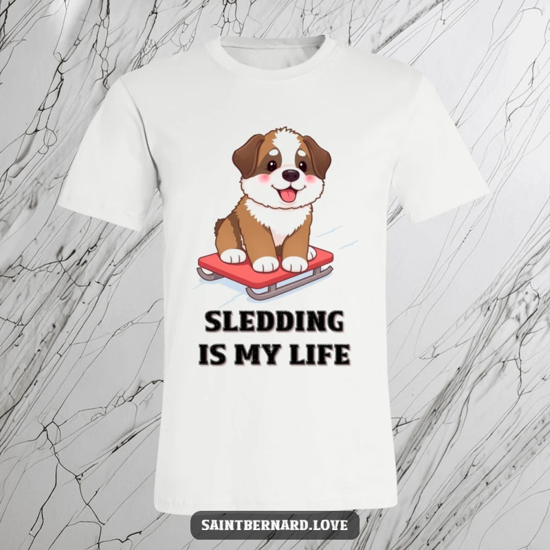 Funny T-Shirt of a fluffy Saint Bernard pup with rosy cheeks, happily sledding down a snow-covered hill, radiating winter cheer.