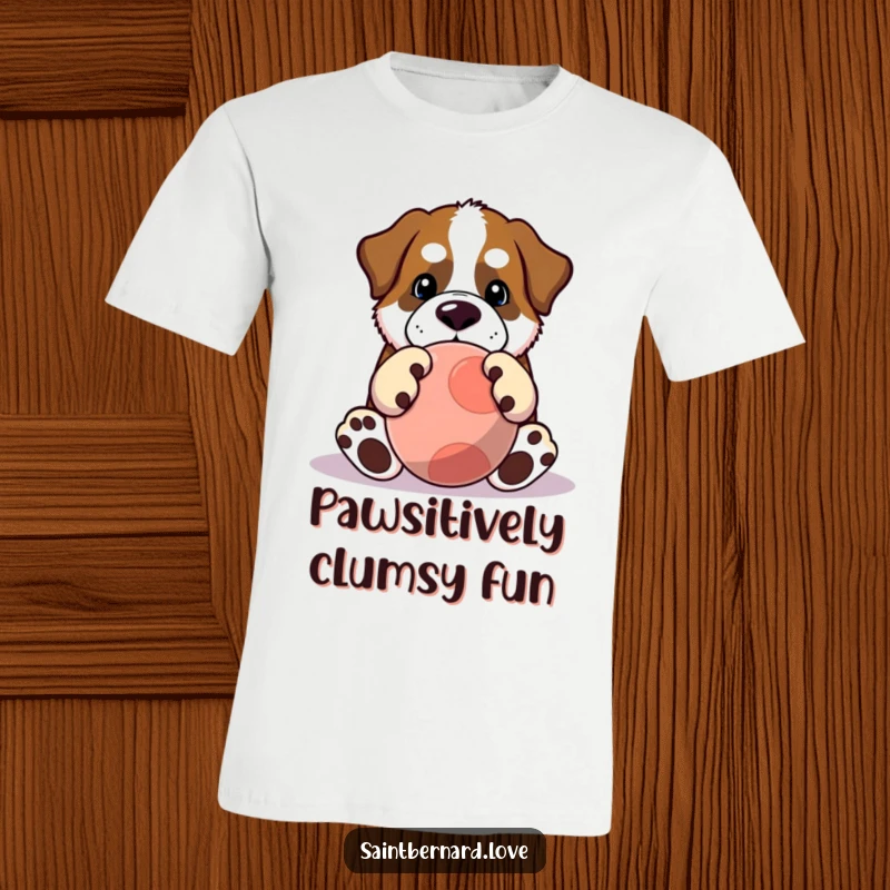 Funny Saint Bernard t-shirt depicting a Kawaii dog with huge paws enthusiastically playing with a large ball. A humorous shirt.